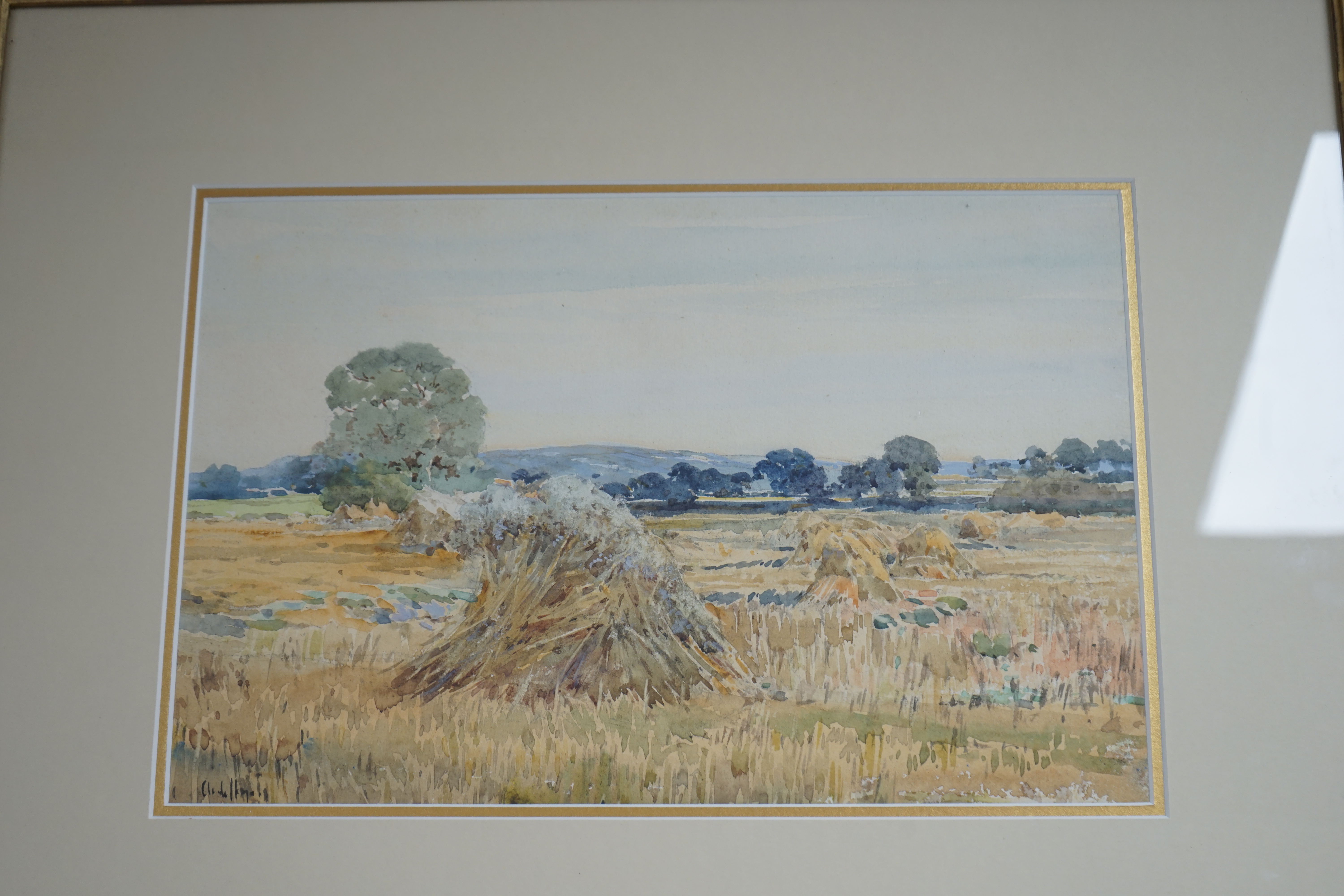 Claude Hayes (1852-1922), two watercolours, 'Haymaking, Norfolk' and 'Cornfield near Bredon, Worcestershire', each signed, 24 x 34cm, gilt framed. Condition - poor to fair, some staining and foxing